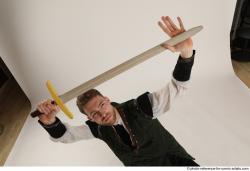 KEETA KNEELING POSE WITH SWORD